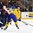 BUFFALO, NEW YORK - JANUARY 2: Sweden's Fabian Zetterlund #28 and Slovakia's Alex Tamasi #25 battle for the puck during the quarterfinal round of the 2018 IIHF World Junior Championship. (Photo by Andrea Cardin/HHOF-IIHF Images)

